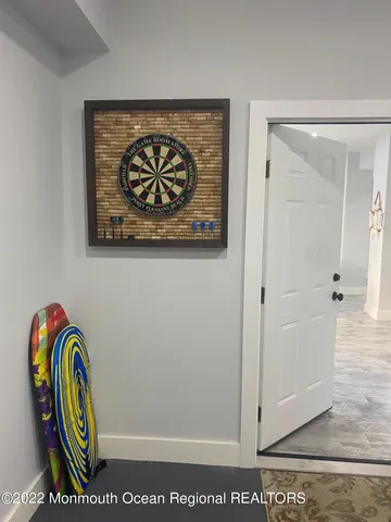 a dining room with furniture and a rug