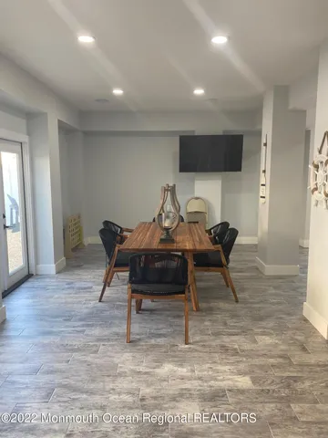 a bathroom with a window and a shower