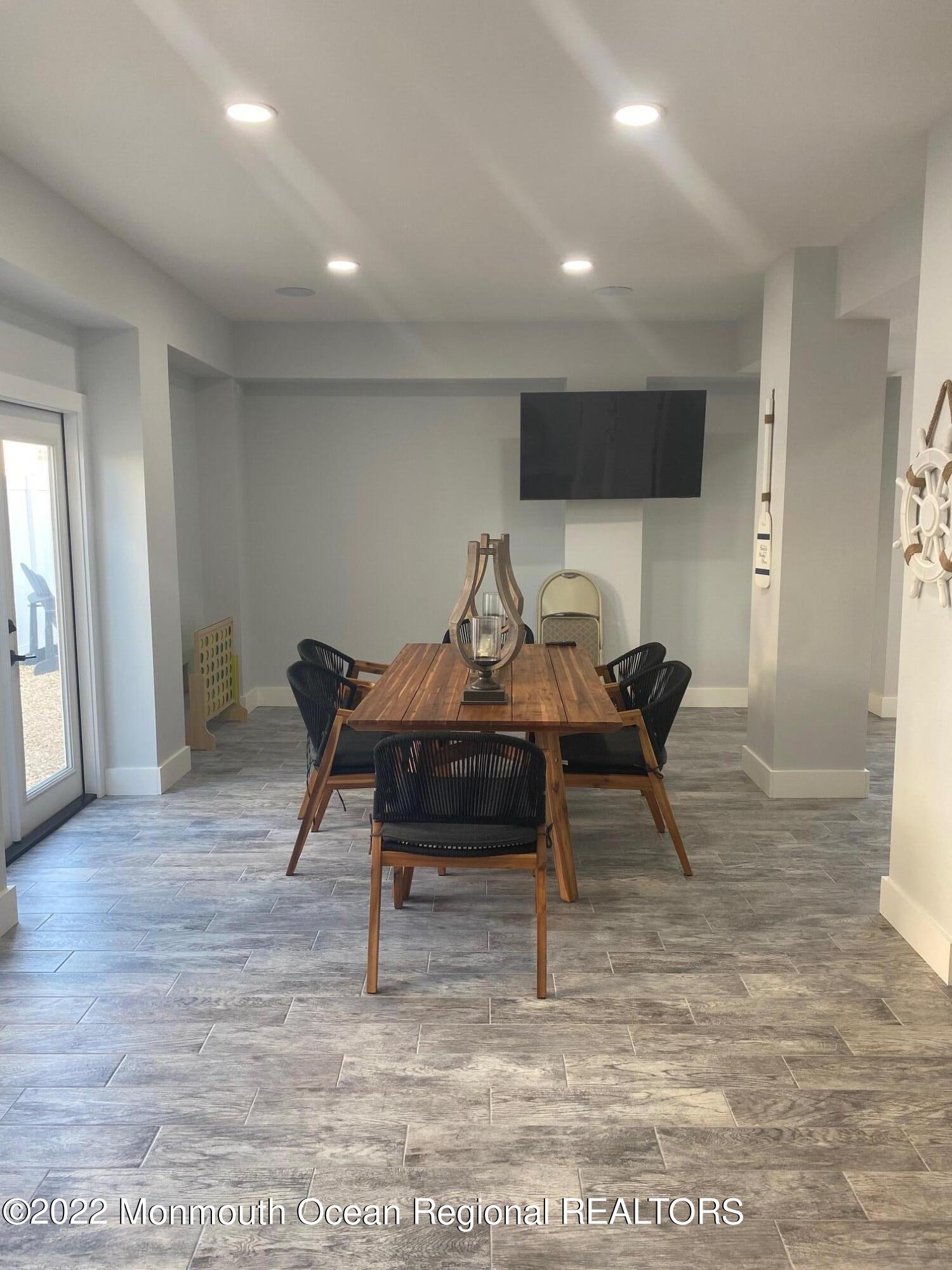 216 Eisenhower Avenue Seaside Heights, NJ 08751 - Photo 36 of 43 a dining room with furniture and a rug