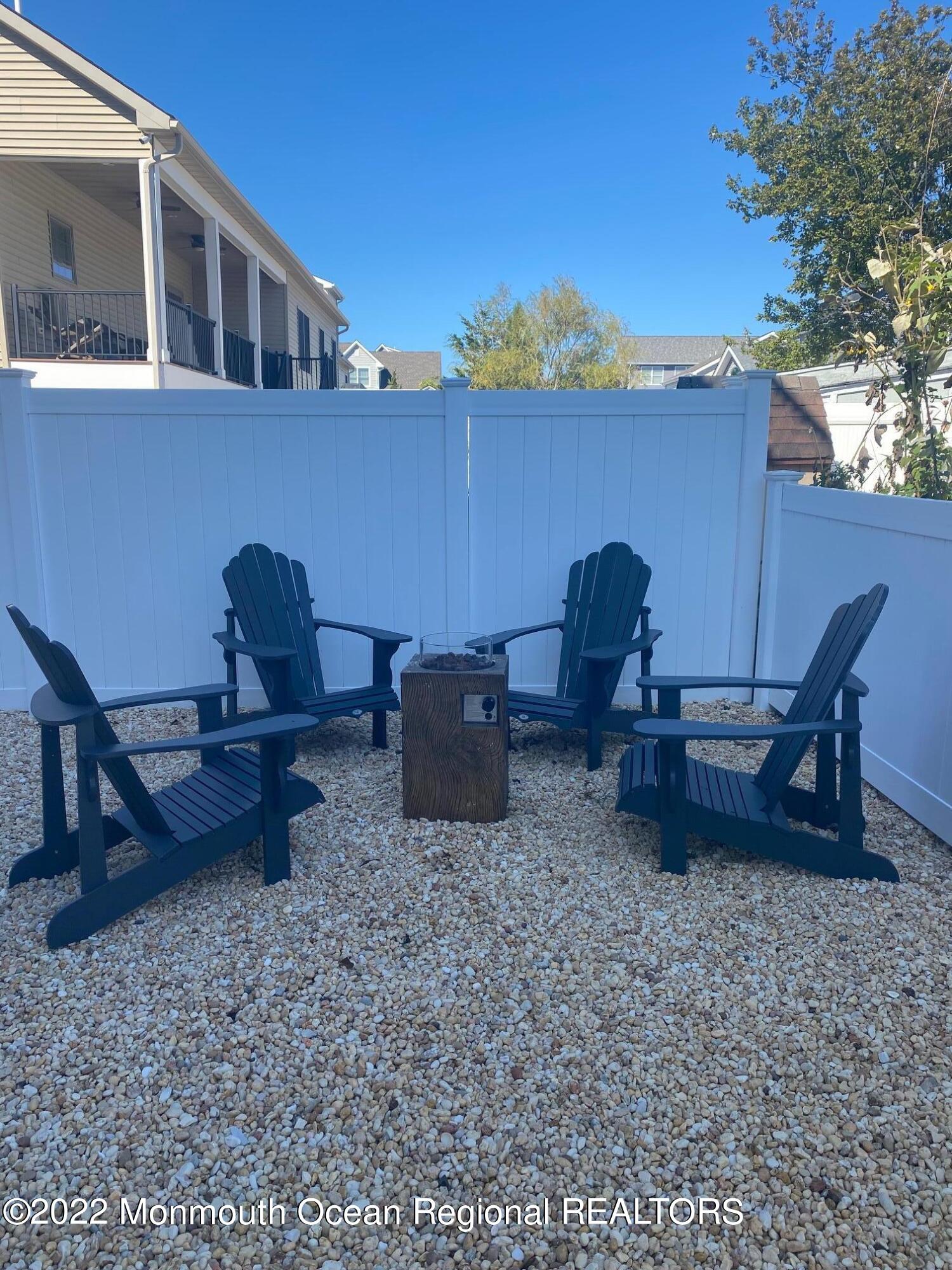 216 Eisenhower Avenue Seaside Heights, NJ 08751 - Photo 42 of 43 a view of a chairs and table in patio