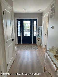 216 Eisenhower Avenue Seaside Heights, NJ 08751 - Photo 6 of 43 wooden floor in an empty room with a window