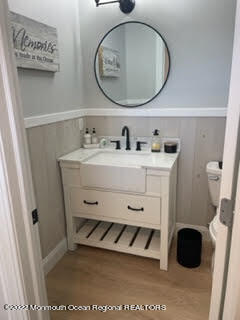 216 Eisenhower Avenue Seaside Heights, NJ 08751 - Photo 9 of 43 a bathroom with a toilet a sink and a mirror