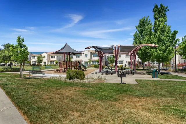 a view of a house with sitting area and swimming pool