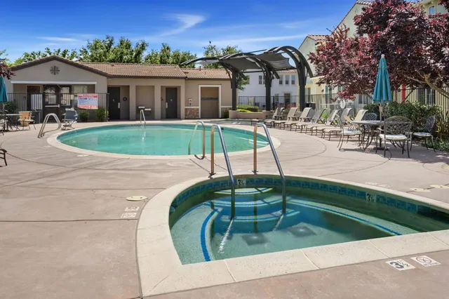a view of a swimming pool with a sitting space