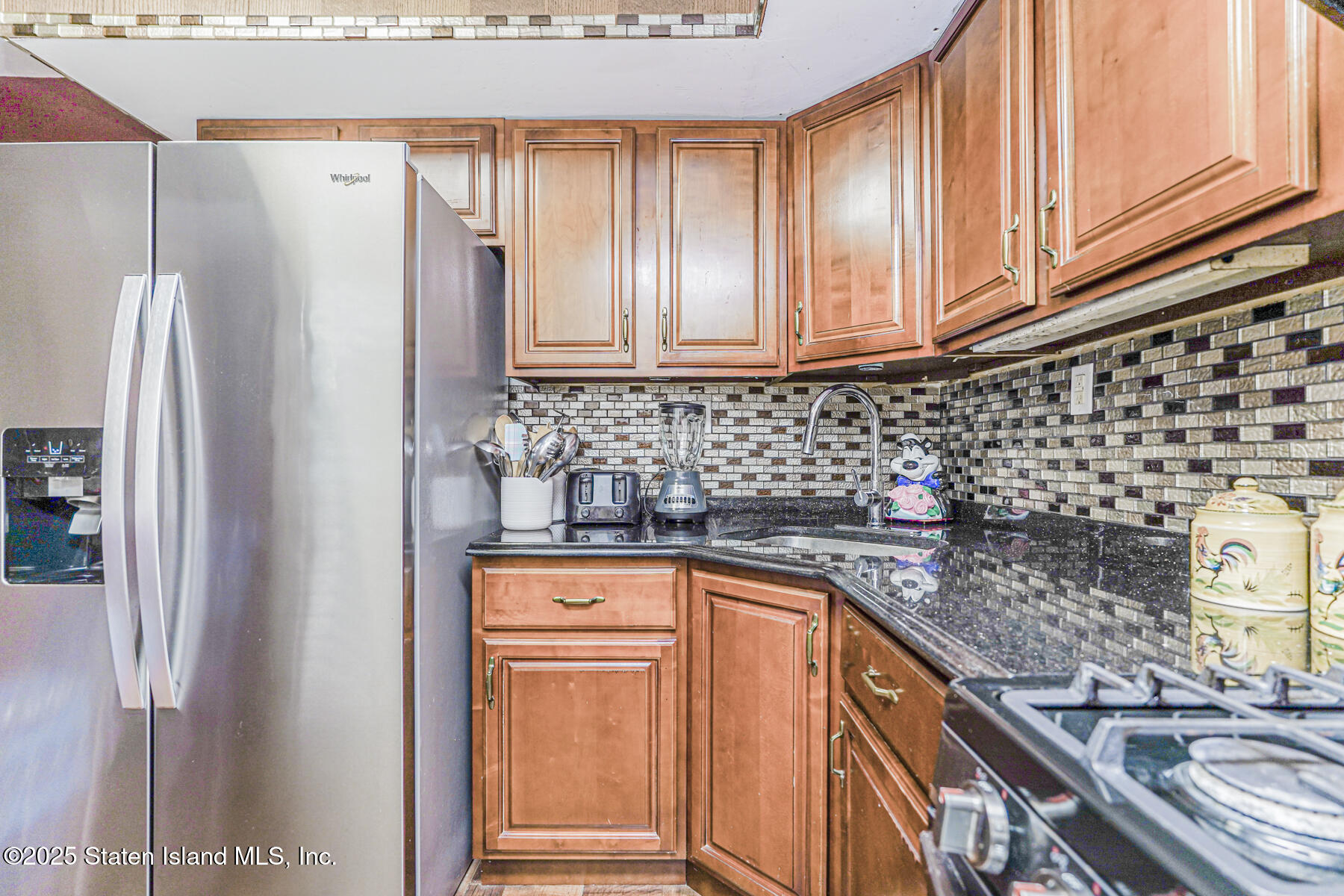 81 Selvin Loop, Unit A Staten Island, NY 10303 - Photo 12 of 25 a kitchen with stainless steel appliances a refrigerator and a sink