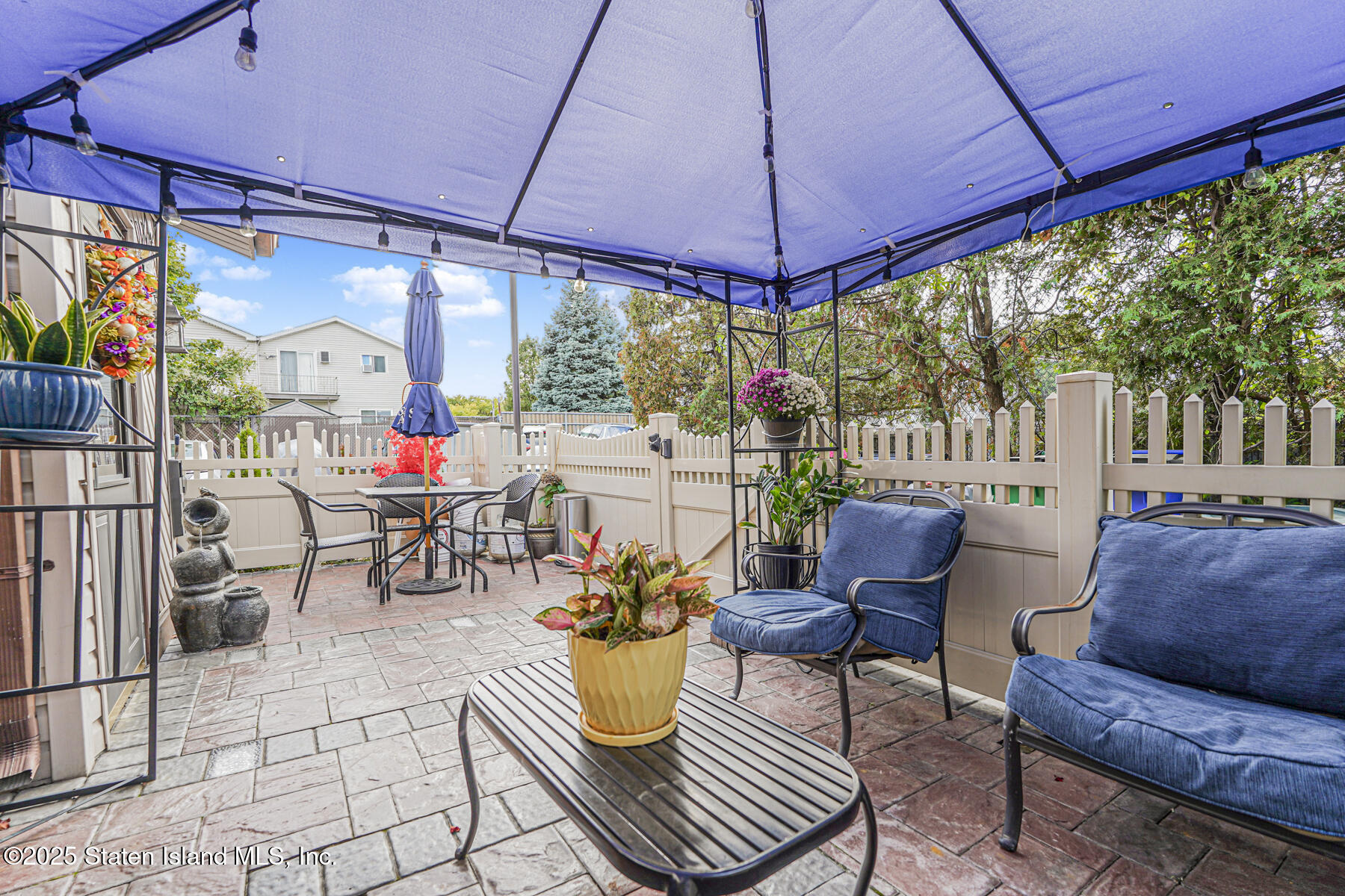 81 Selvin Loop, Unit A Staten Island, NY 10303 - Photo 20 of 25 a outdoor space with patio the couches and chairs
