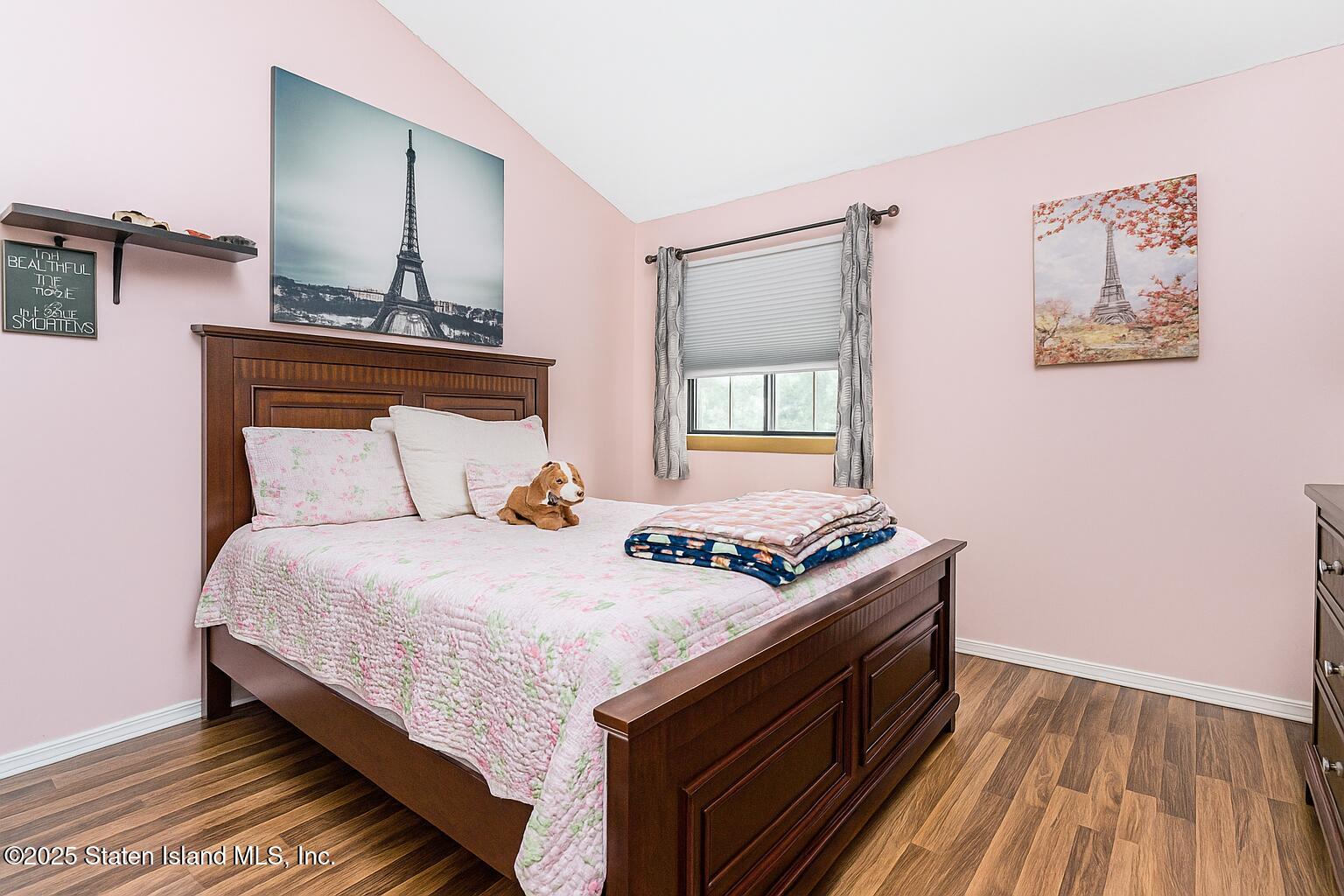 81 Selvin Loop, Unit A Staten Island, NY 10303 - Photo 24 of 25 a bedroom with bed and wooden floor