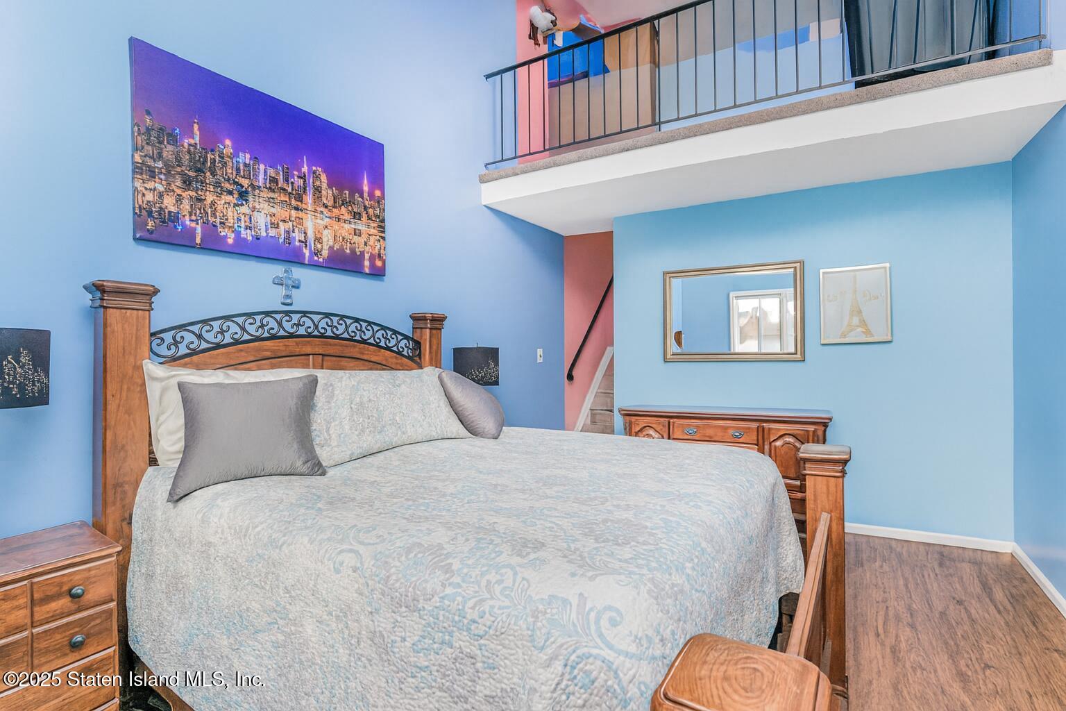 81 Selvin Loop, Unit A Staten Island, NY 10303 - Photo 25 of 25 a bedroom with a bed and a lamp on dresser