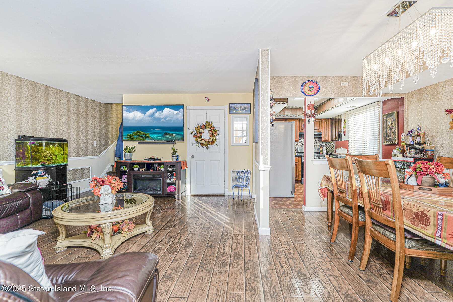 81 Selvin Loop, Unit A Staten Island, NY 10303 - Photo 4 of 25 a living room with furniture and a flat screen tv