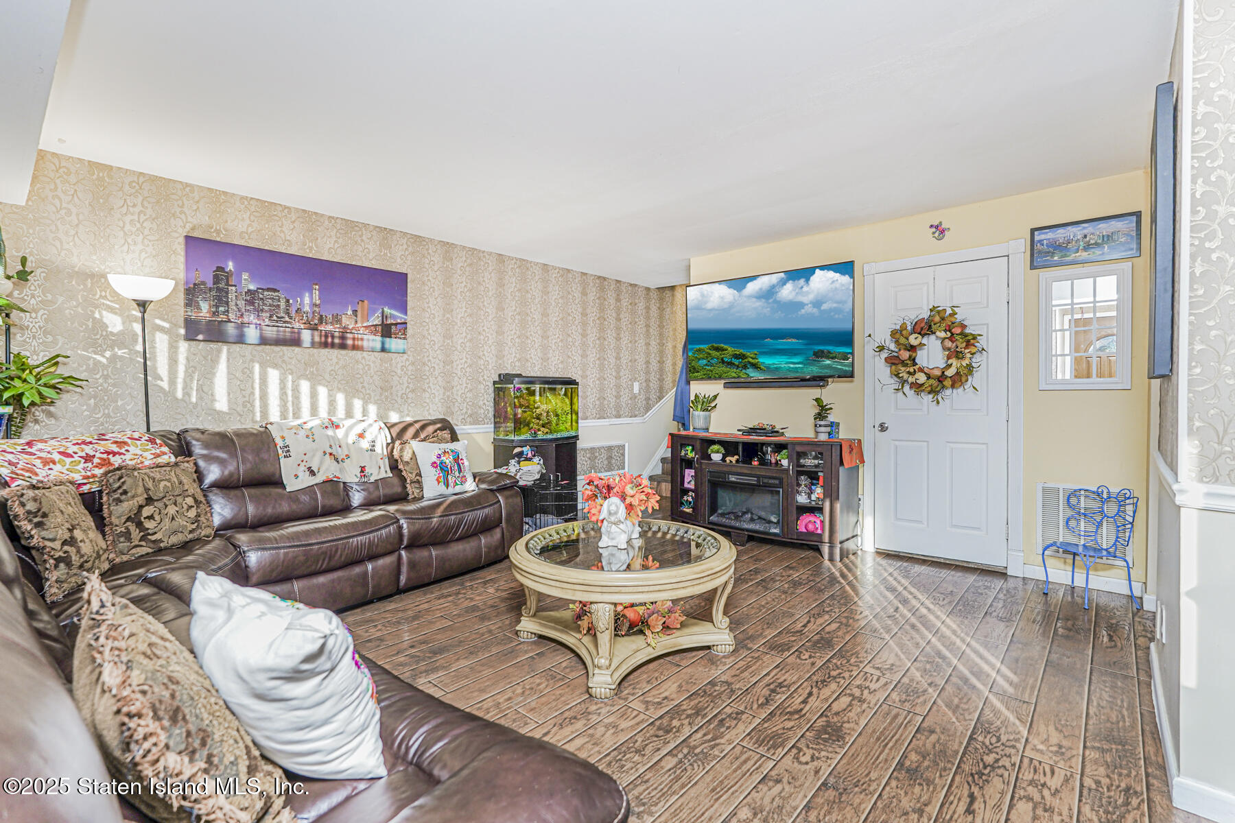 81 Selvin Loop, Unit A Staten Island, NY 10303 - Photo 5 of 25 a living room with furniture and a wooden floor