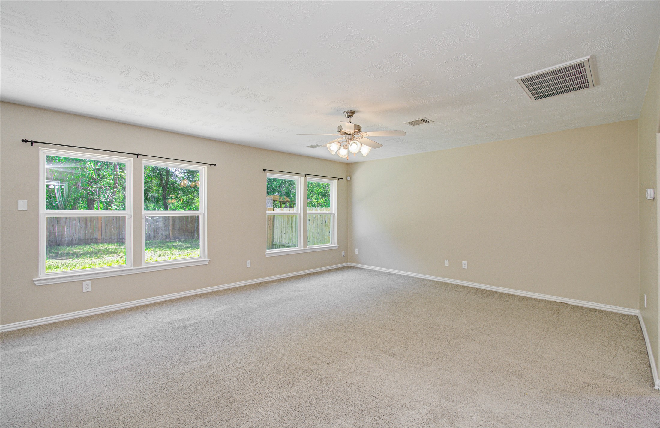3414 Hunter's Canyon Baytown, TX 77521 - Photo 11 of 43 Living area with large windows overlooking the backyard!