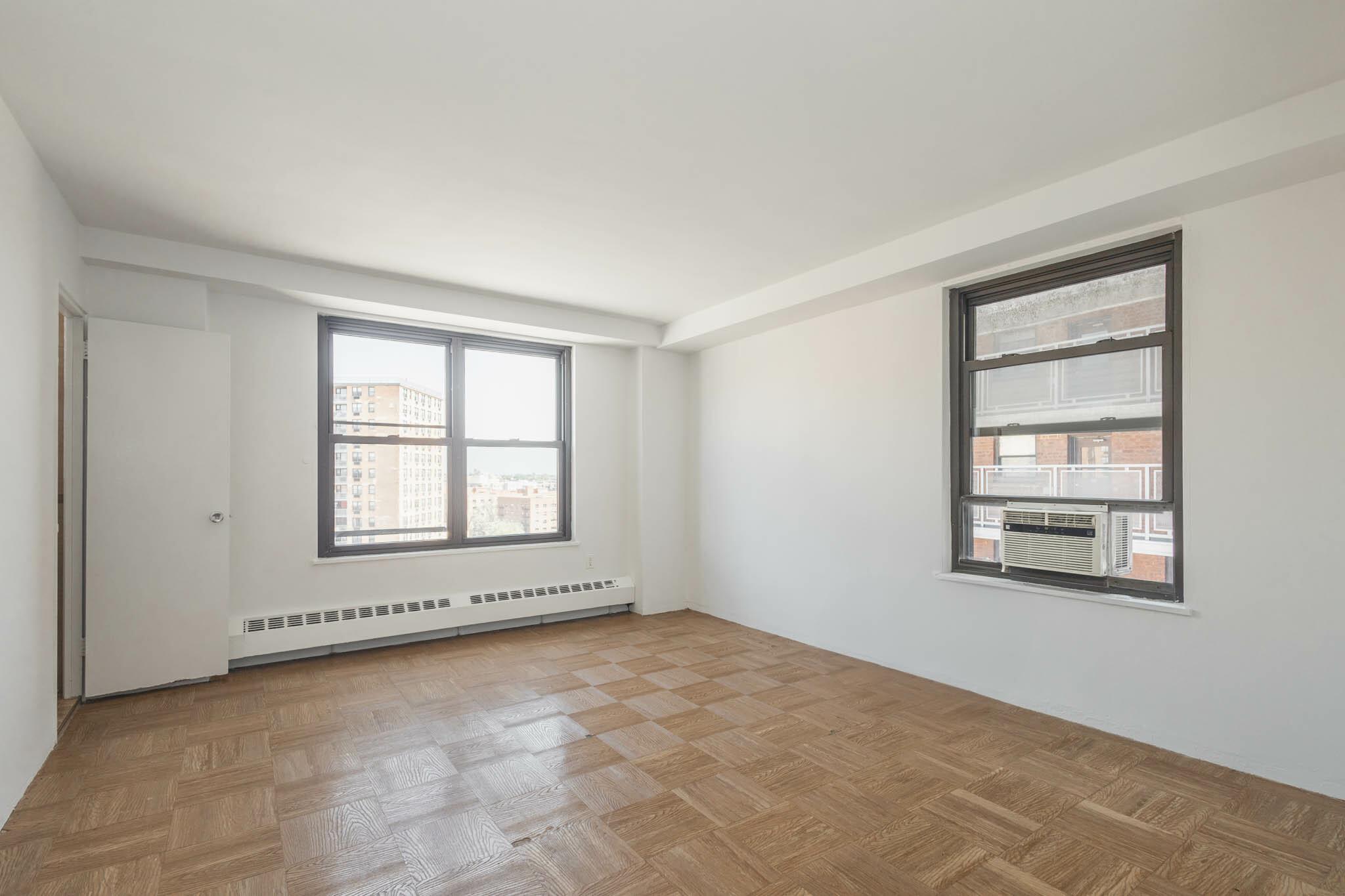 61-25 98th Street, Unit 11E Queens, NY 11374 - Photo 12 of 31 an empty room with a window