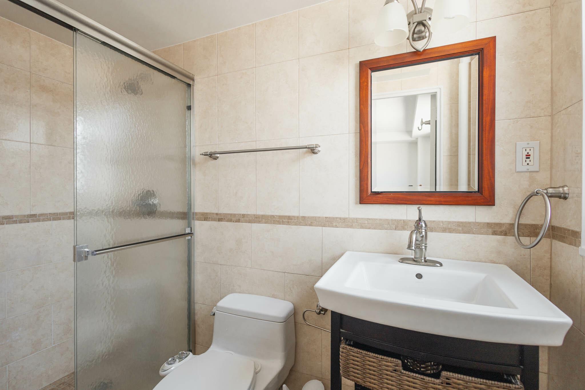 61-25 98th Street, Unit 11E Queens, NY 11374 - Photo 14 of 31 a bathroom with a sink a toilet and shower