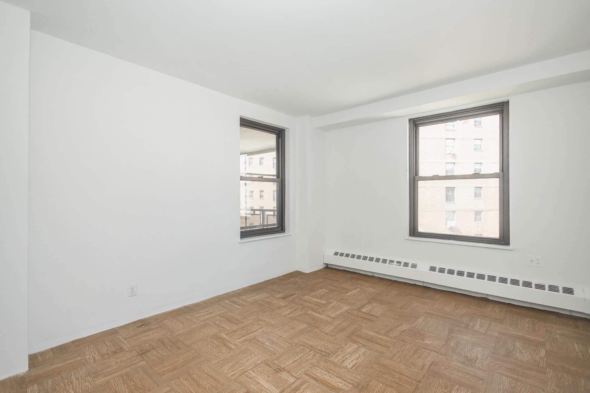 61-25 98th Street, Unit 11E Queens, NY 11374 - Photo 17 of 31 an empty room with a window