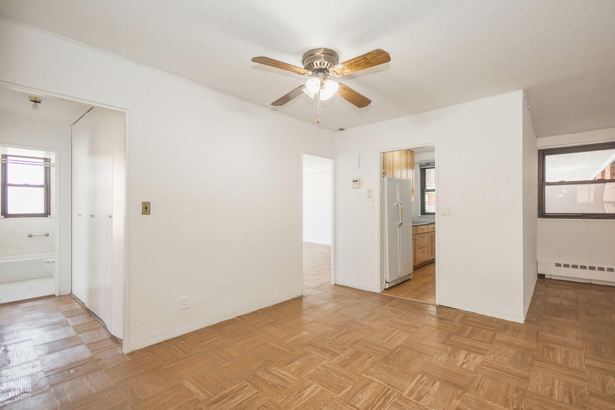 61-25 98th Street, Unit 11E Queens, NY 11374 - Photo 9 of 31 a view of an empty room with a window