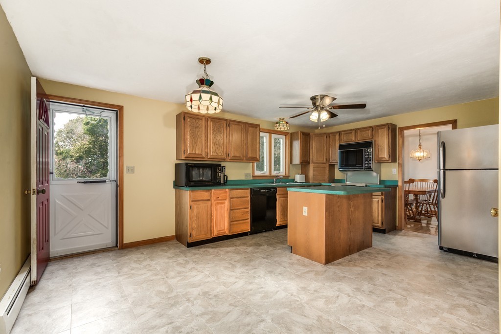 34 Central Tree Road Rutland, MA 01543 - Photo 11 of 30 a view of a kitchen with refrigerator and microwave