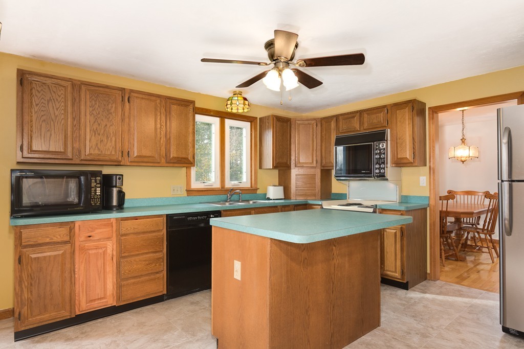 34 Central Tree Road Rutland, MA 01543 - Photo 13 of 30 a kitchen with stainless steel appliances granite countertop a sink and cabinets