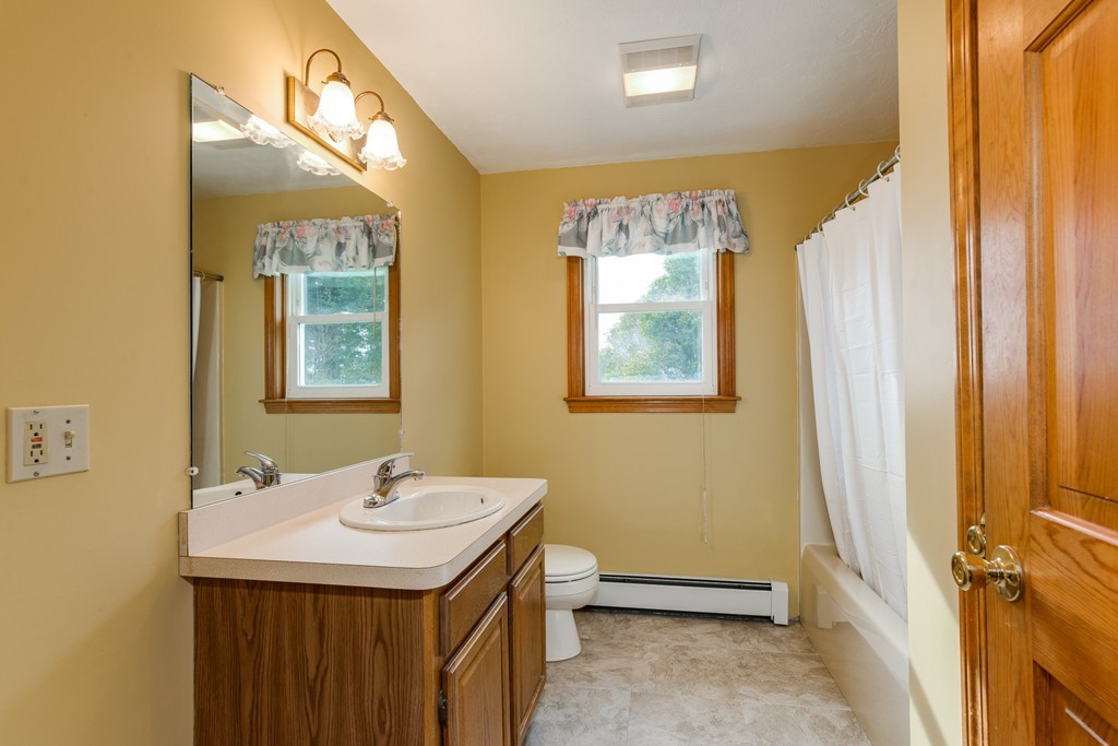 34 Central Tree Road Rutland, MA 01543 - Photo 22 of 30 a bathroom with a sink a mirror and a shower