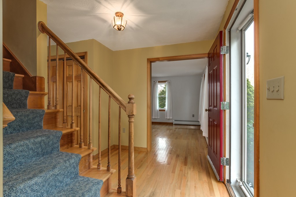 34 Central Tree Road Rutland, MA 01543 - Photo 7 of 30 a view of a hallway with wooden floor and staircase
