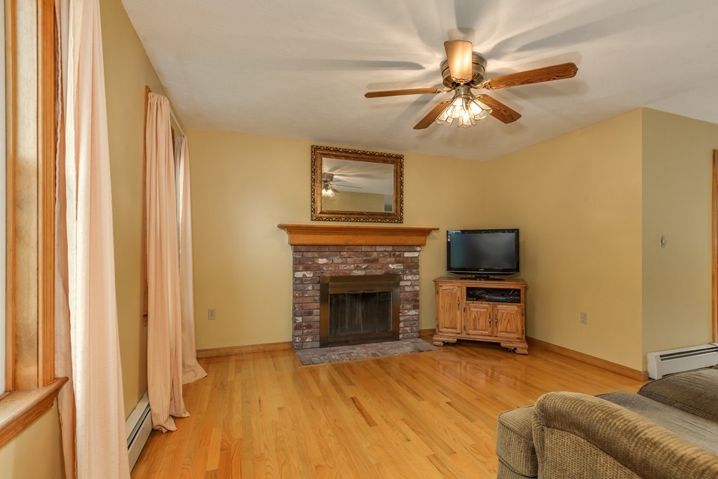 34 Central Tree Road Rutland, MA 01543 - Photo 8 of 30 a living room with furniture and a fireplace