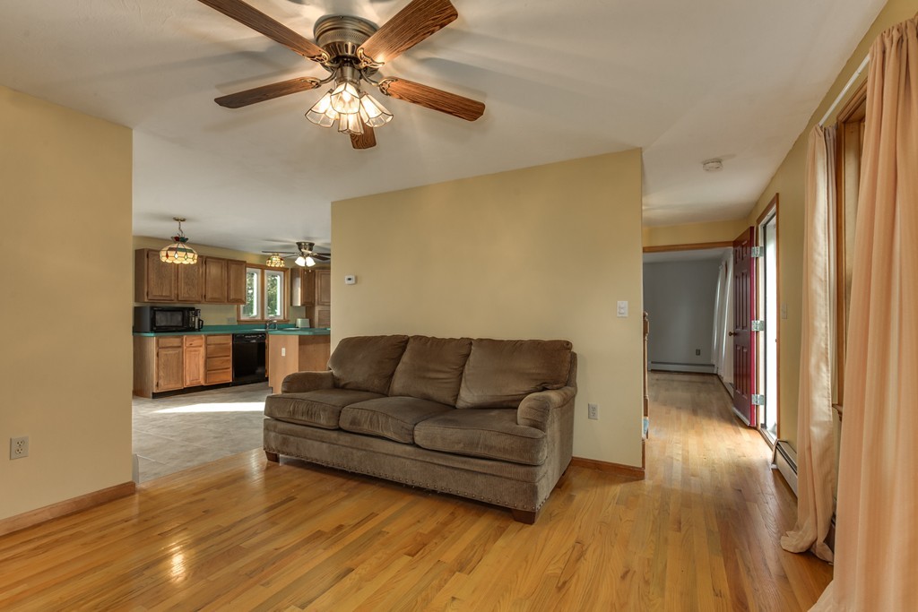 34 Central Tree Road Rutland, MA 01543 - Photo 9 of 30 a living room with furniture and a chandelier