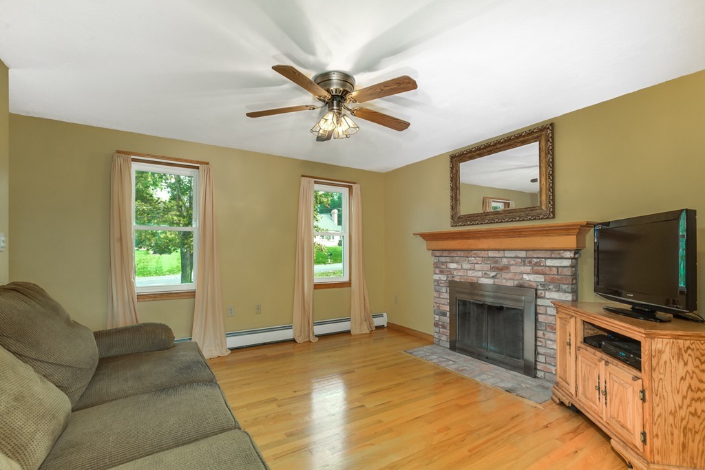 34 Central Tree Road Rutland, MA 01543 - Photo 10 of 30 a living room with furniture and a fireplace