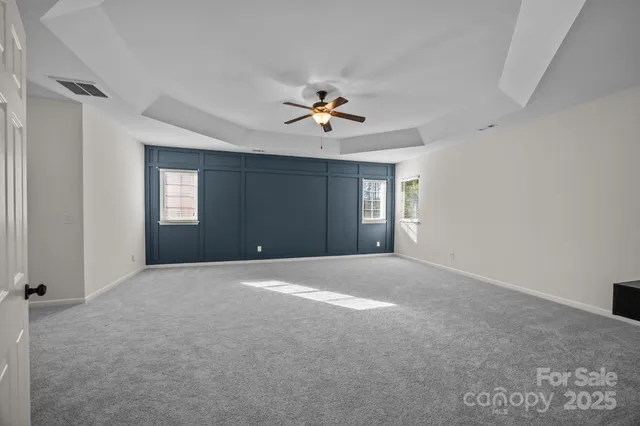 a view of empty room with fan