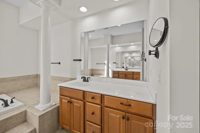 a bathroom with a sink double vanity and shower