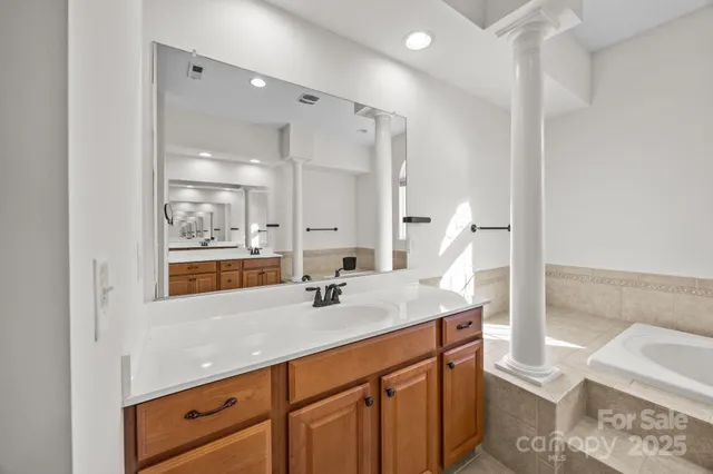 a bathroom with a shower and a sink