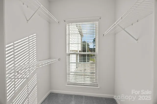 a front view of a house with yard patio and swimming pool