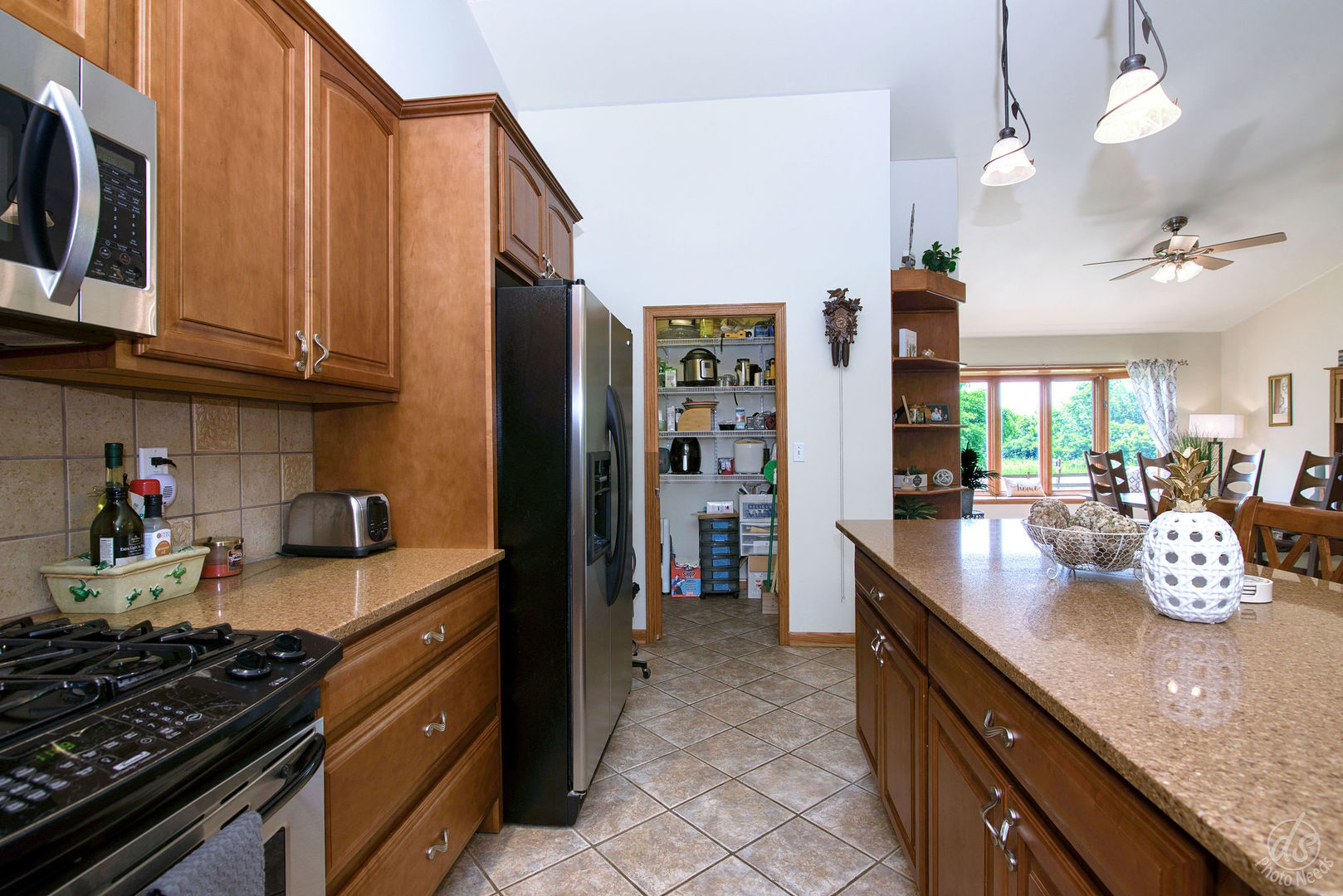 28671 Moose Range Road Sycamore, IL 60178 - Photo 15 of 69 a kitchen with granite countertop lots of stainless steel appliances granite countertop a stove and a refrigerator