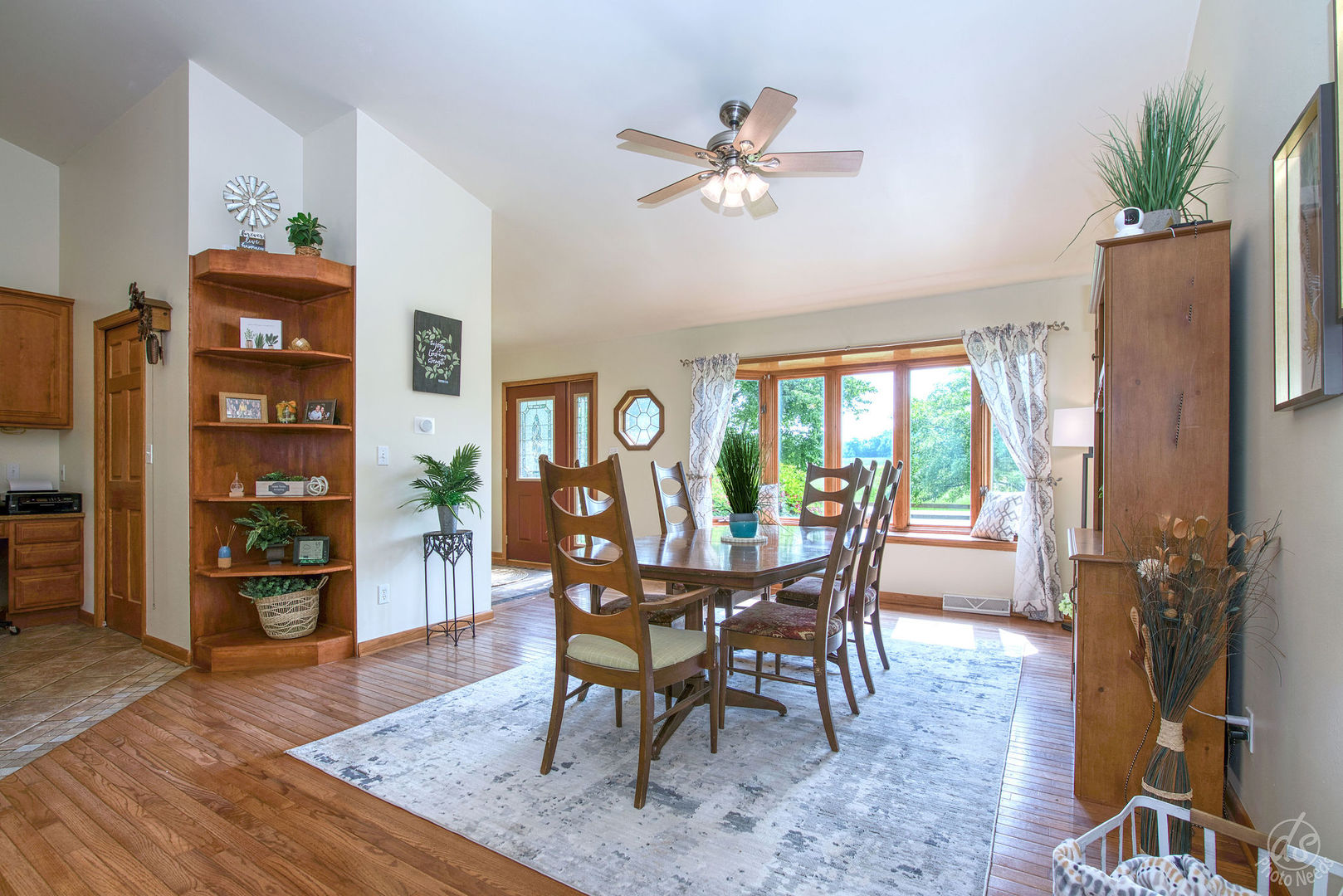 28671 Moose Range Road Sycamore, IL 60178 - Photo 18 of 69 a dining room with furniture potted plants and wooden floor