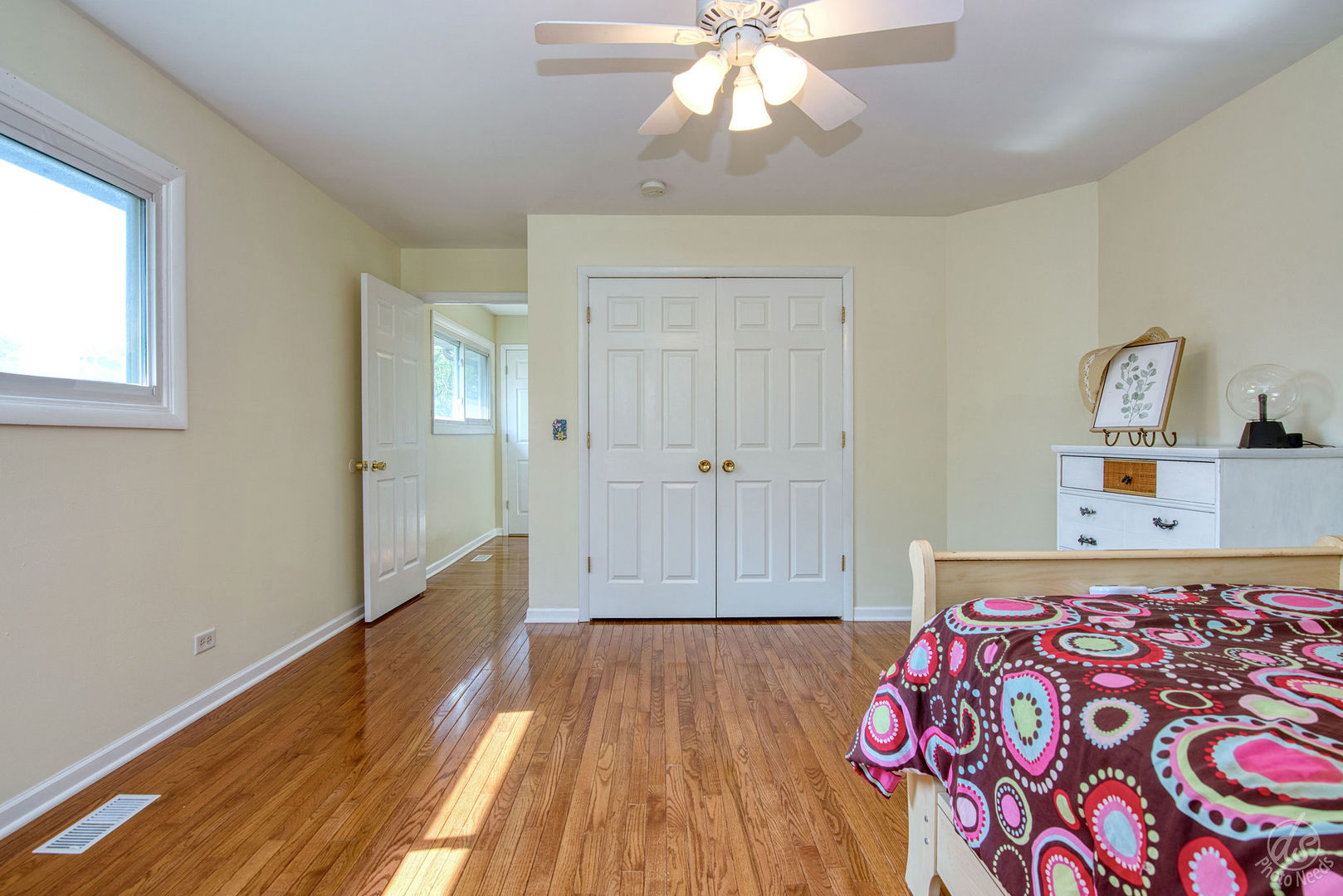 28671 Moose Range Road Sycamore, IL 60178 - Photo 26 of 69 a bedroom with wooden floor and a chandelier