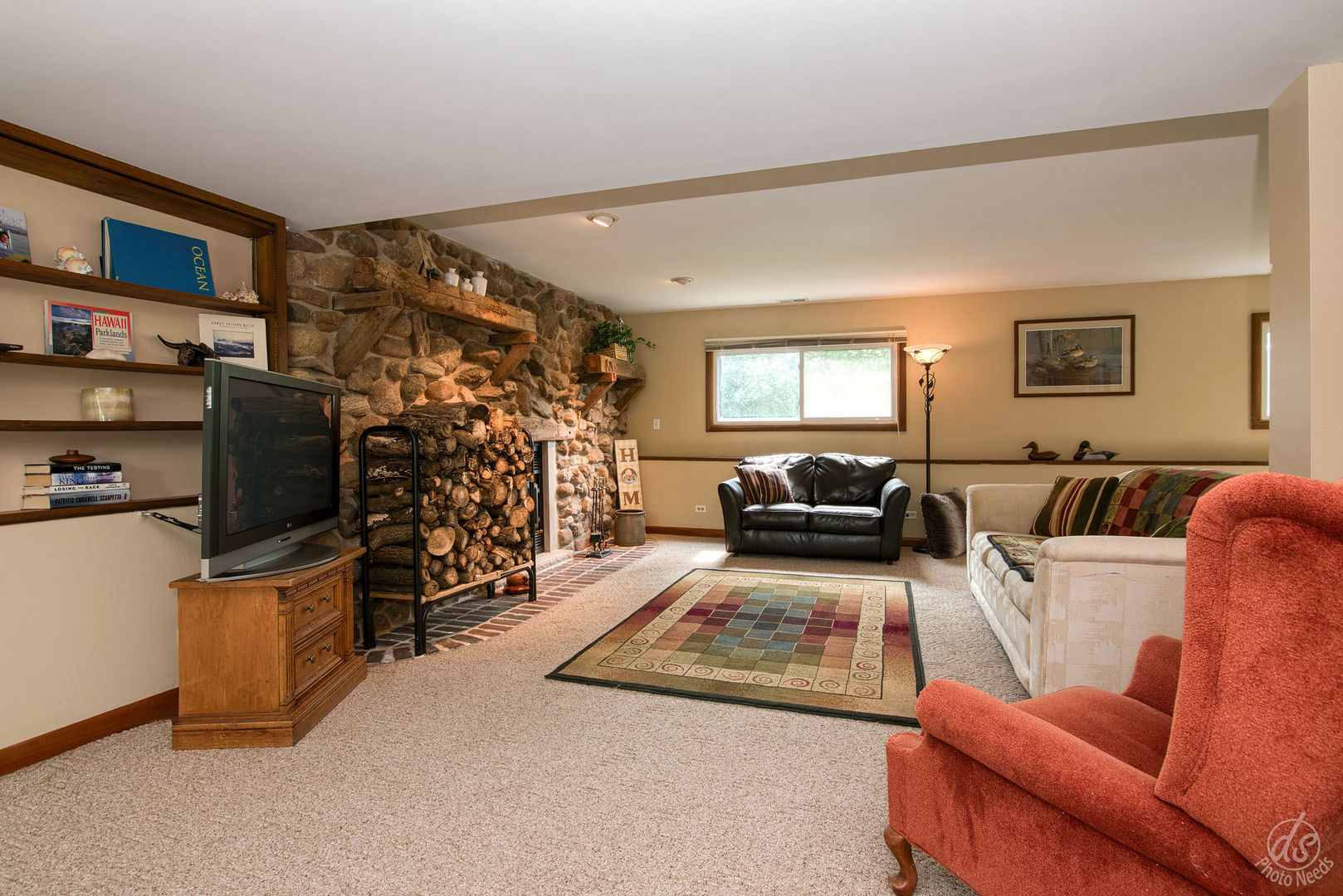 28671 Moose Range Road Sycamore, IL 60178 - Photo 35 of 69 a living room with furniture and a flat screen tv