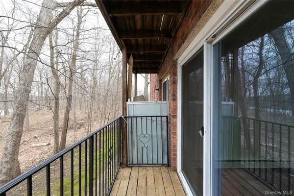 a view of balcony with wooden floor