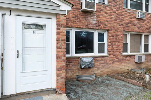 a front view of a house with outdoor space and windows