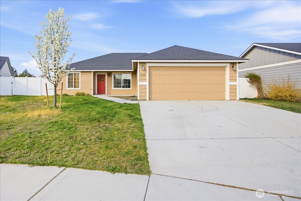 3709 Morehouse Place Pasco, WA 99301 - Photo 1 of 32 a front view of a house with garden