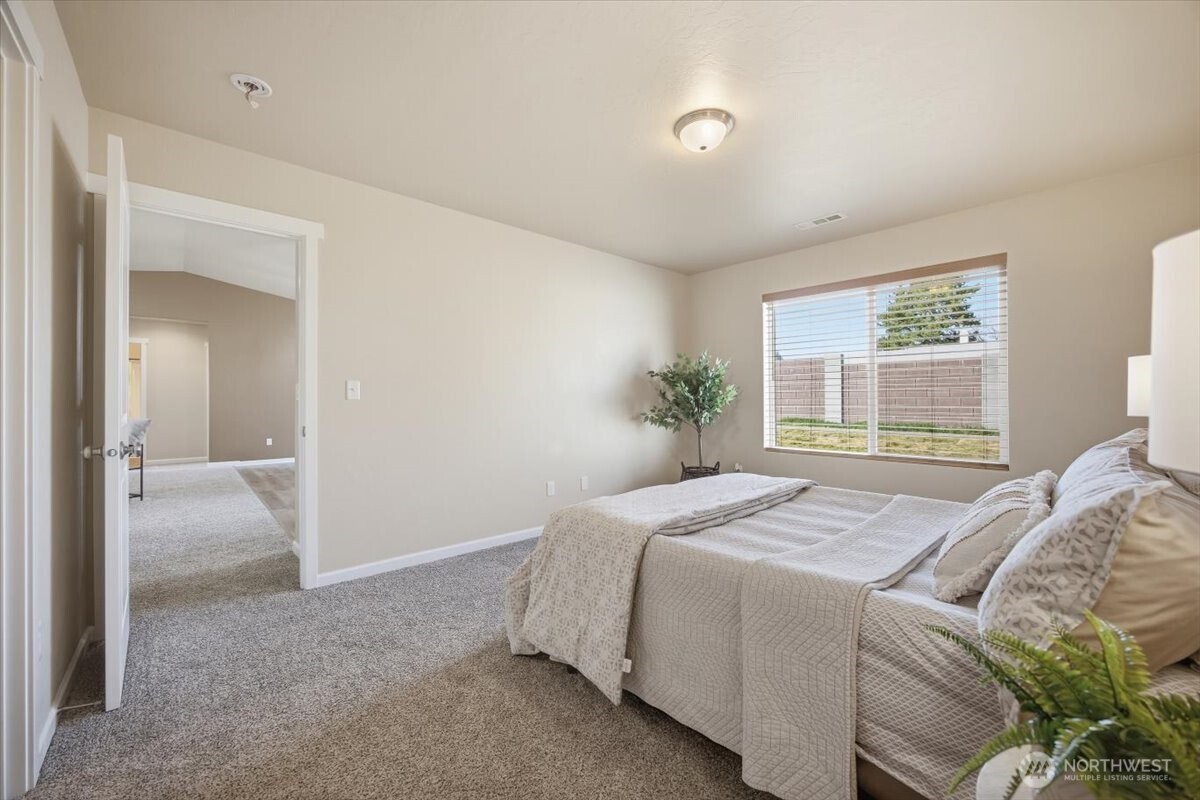 3709 Morehouse Place Pasco, WA 99301 - Photo 23 of 32 a bedroom with a bed and a window