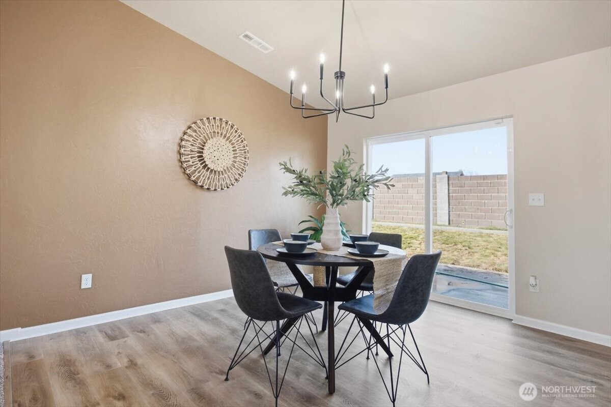3709 Morehouse Place Pasco, WA 99301 - Photo 9 of 32 a view of a dining room with furniture window and wooden floor