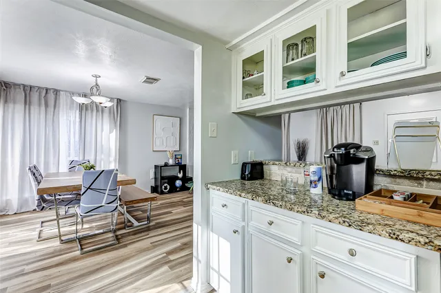 a kitchen with stainless steel appliances granite countertop a stove and a sink