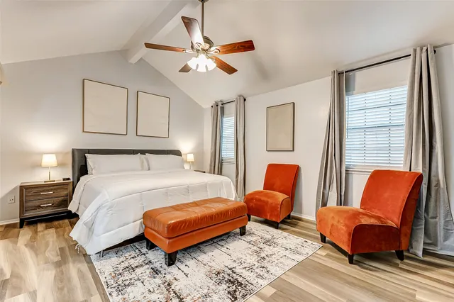 a bedroom with furniture and a window