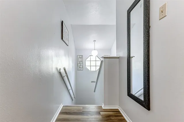 a view of staircase with white walls