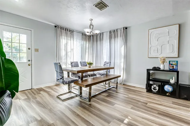 a living room with a bed furniture and a window