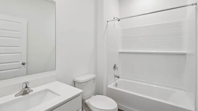 a bathroom with a sink toilet and bathtub