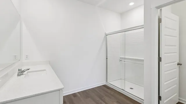 a bathroom with a sink and shower