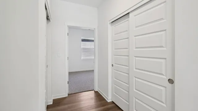 a view of walk in closet with empty racks