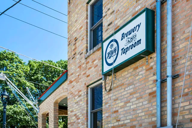 a sign on a brick building