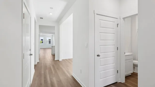 a view of a bathroom with wooden floor