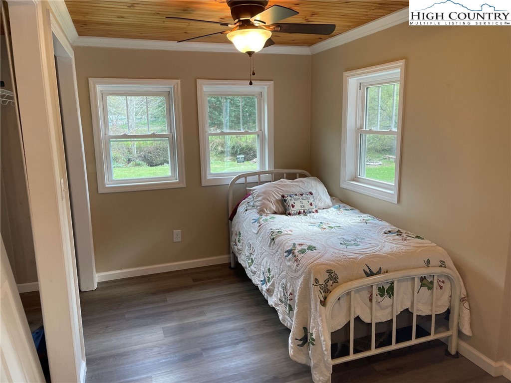3350 Teaberry Road Lansing, NC 28643 - Photo 21 of 30 a bedroom with a bed next to a window