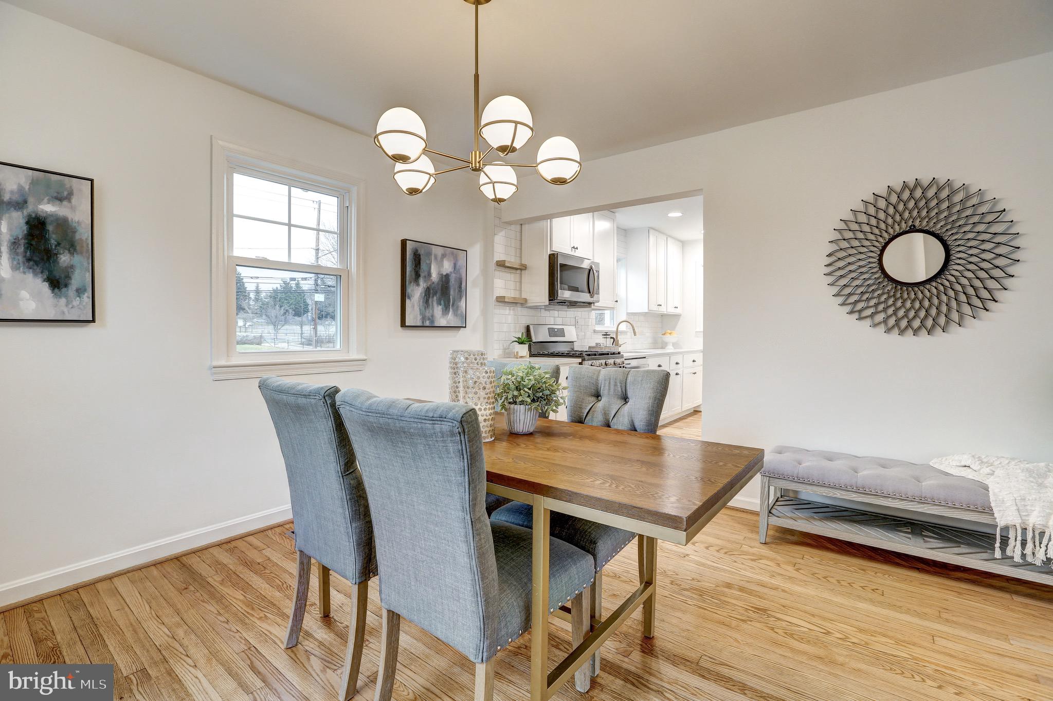 2116 Forest Glen Road Silver Spring, MD 20910 - Photo 12 of 57 a view of a dining room with furniture wooden floor and chandelier